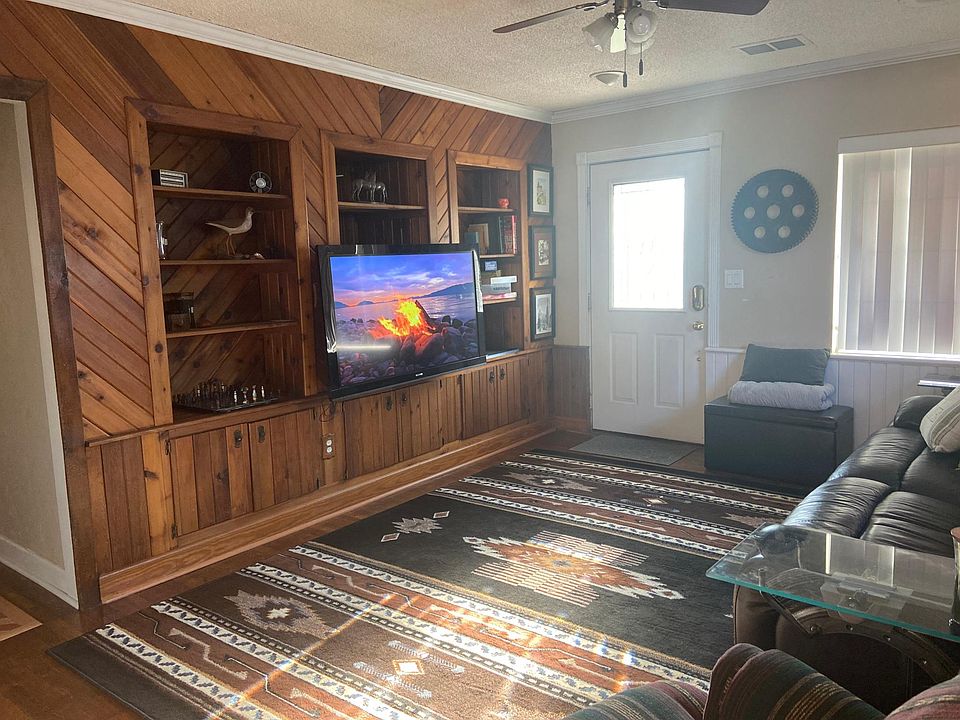Furnished living room with TV.