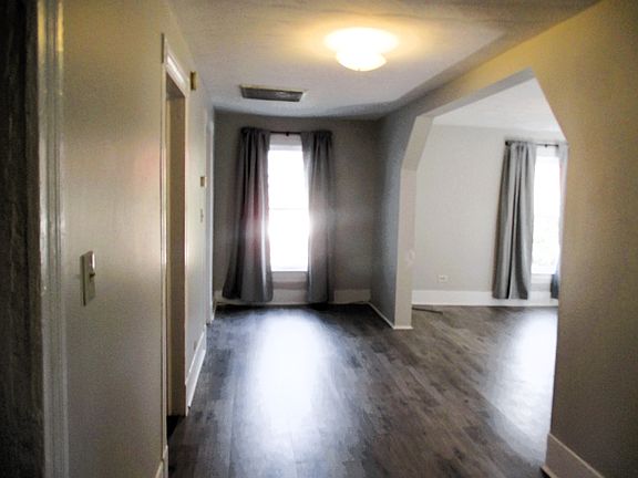 Large hallway looking into living room