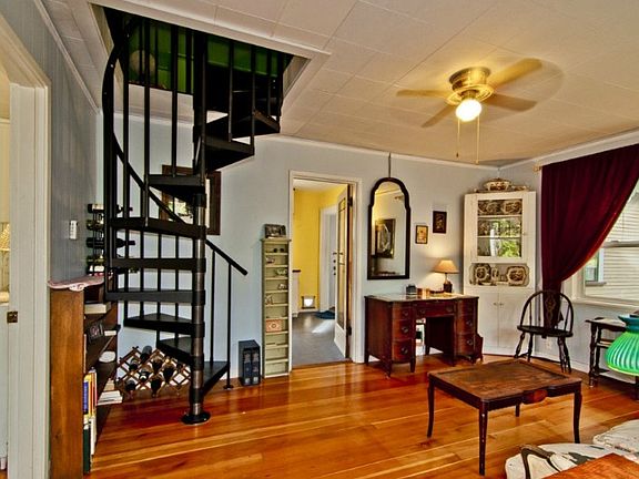 Spiral staircase goes up to a fantastic finished loft (guest room or office)