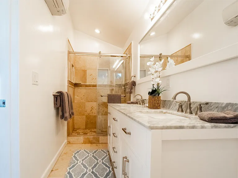 Master bath with dual sinks & walk-in shower.