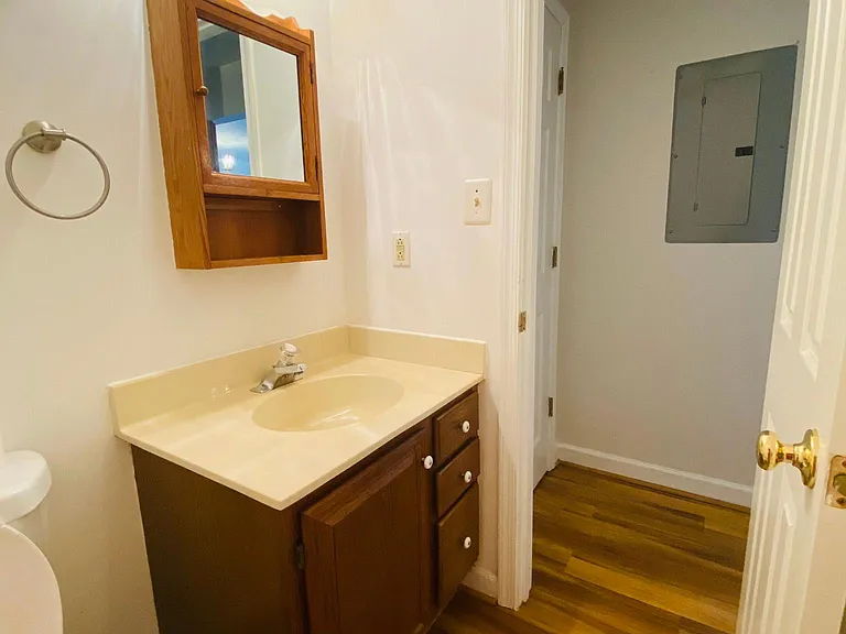 Haft bathroom near kitchen