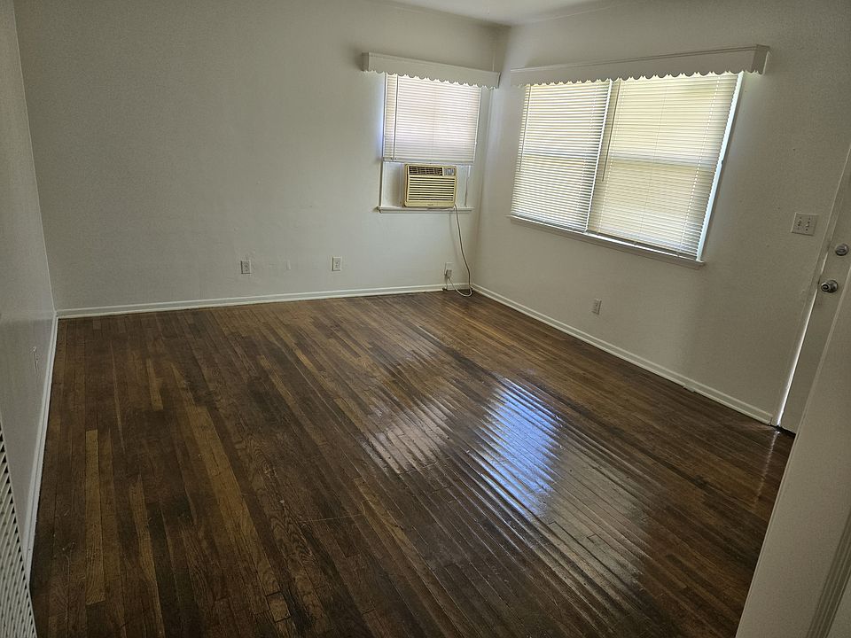 Large living room with vintage hardwood floors
