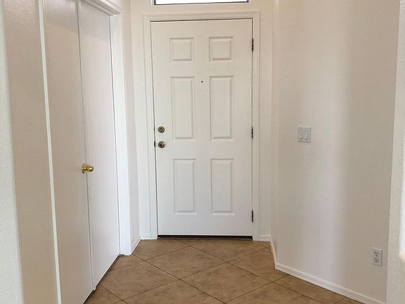 Entryway; den/third bedroom to the left and master bedroom to the right