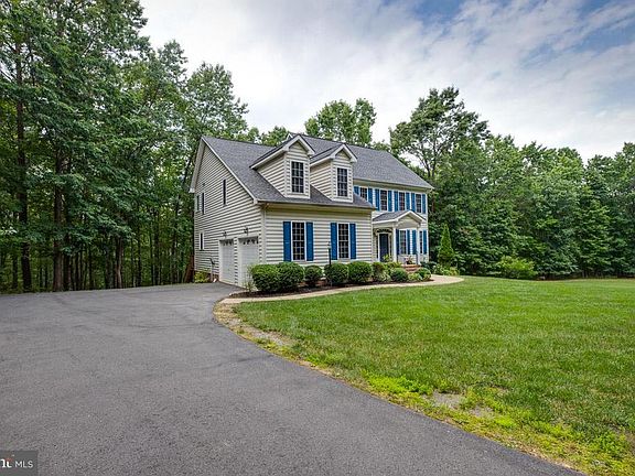 2-car garage, driveway with extra parking area