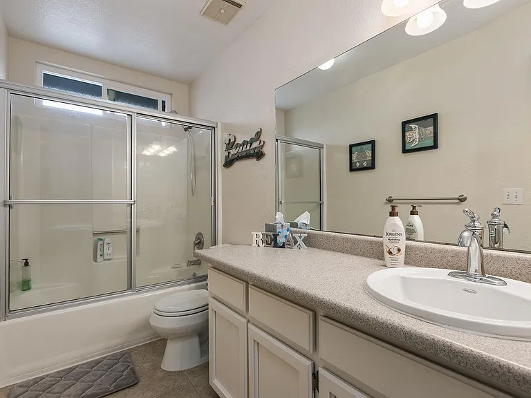 Bathroom located upstairs in the hallway.