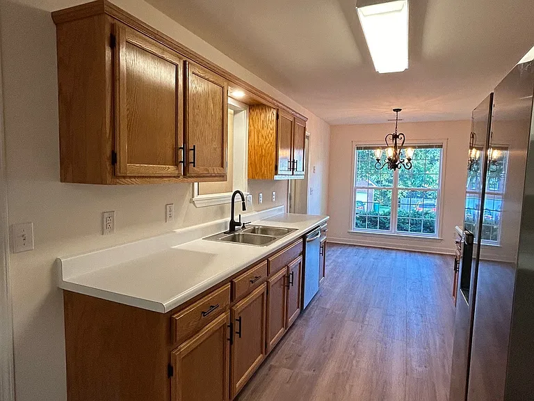 Galley kitchen with stainless steel appliances