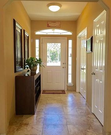 Bright foyer with a convenient coat closet
