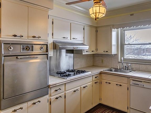 Kitchen has instant hot water dispenser, disposal, original stainless oven and newer stainless stove