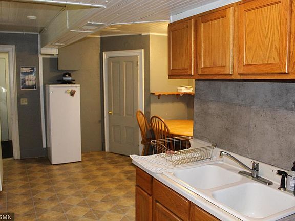 Kitchen and dining room, next to a main floor bathroom.