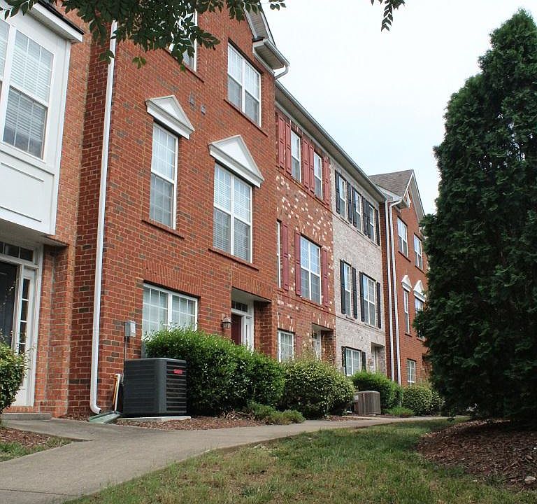 Quiet sidewalk and creek to front of property