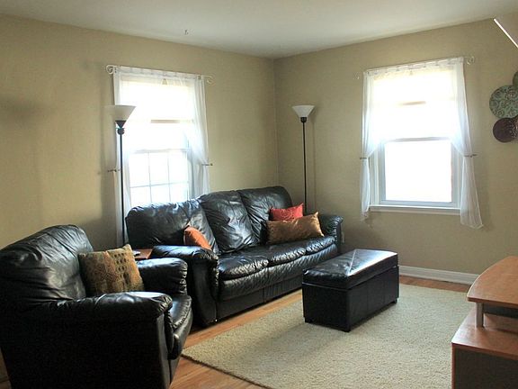 Main floor living room with newly refinished hardwood