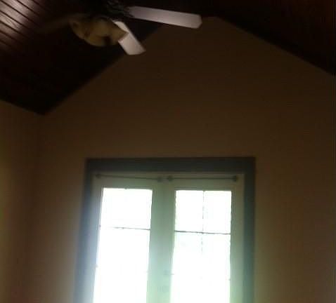 2nd bedroom with beautiful vaulted ceiling and french doors