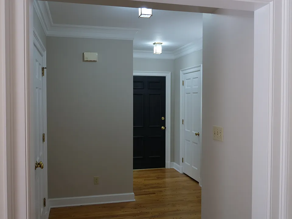 Front entrance foyer facing apartment entrance door.