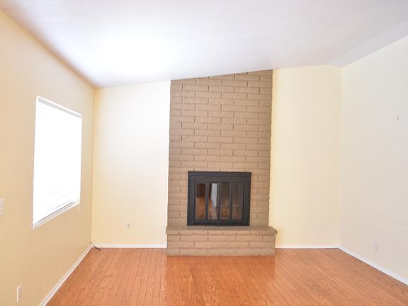Family room with wood-burning fireplace.