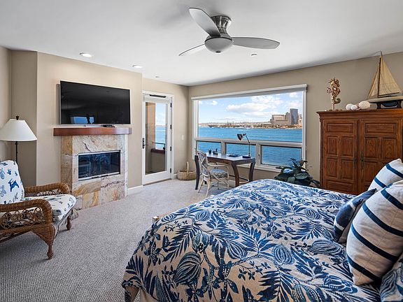 Primary bedroom with views to San Diego/Coronado Bay. Spacious room with door leading to balcony.