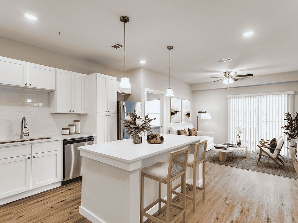 Experience the perfect blend of style and comfort in this open-concept kitchen and living area.