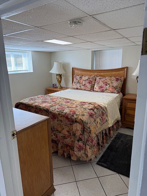 bedroom with queen bed plus large side tables with allot of storage