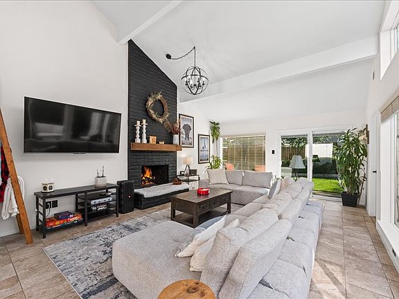 Spacious living room with working fireplace.