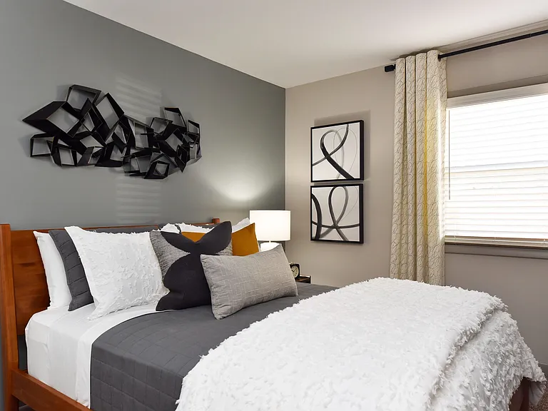 Experience comfort and style in this beautifully designed bedroom.