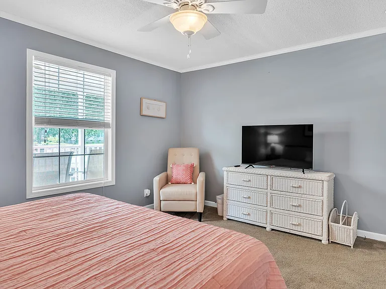 Comfortable chair, ROKU tv and dresser