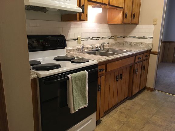 Kitchen with tiled backsplash and new countertop