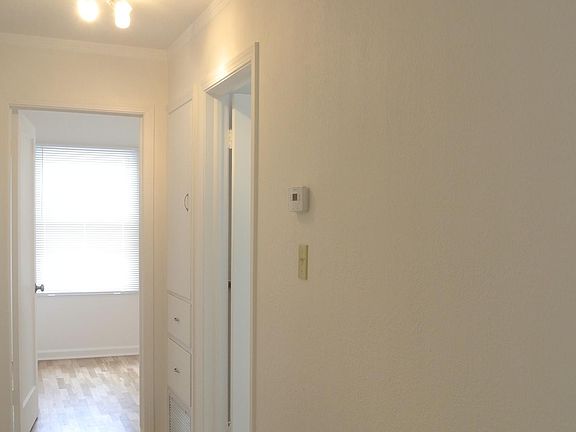 Hallway, programmable thermostat for central heat and air conditioning, and carbonmonoxide detector (not in picture)
