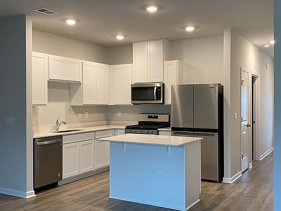 Kitchen, white cabinets, all new stainless appliances, gas burners, refrigerator