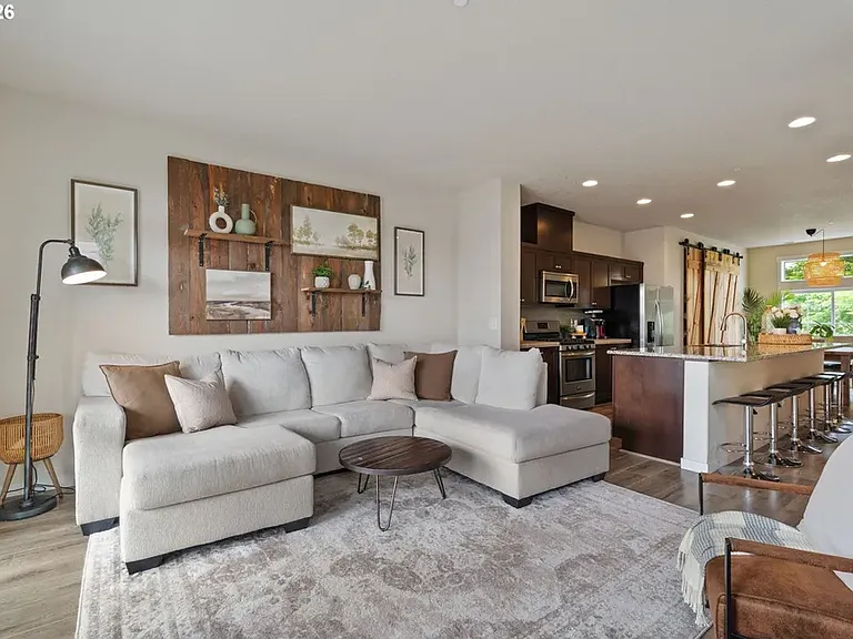 Main level flows seamlessly from living to kitchen to dining