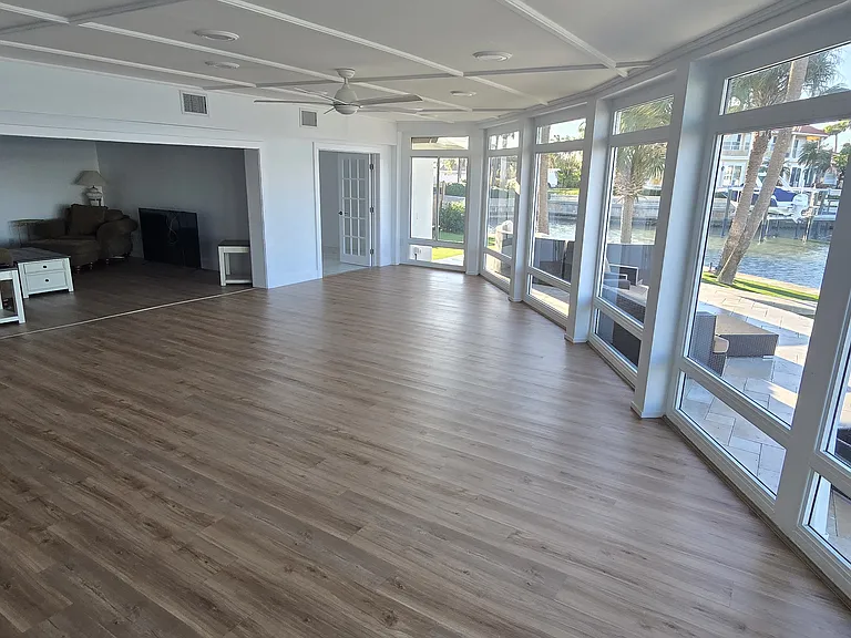 2nd Living room looking back into living room. Floor to ceiling water views.