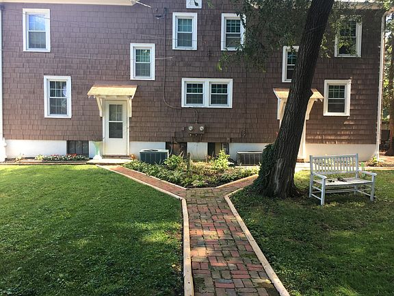 backyard. enclosed by white picket fence.