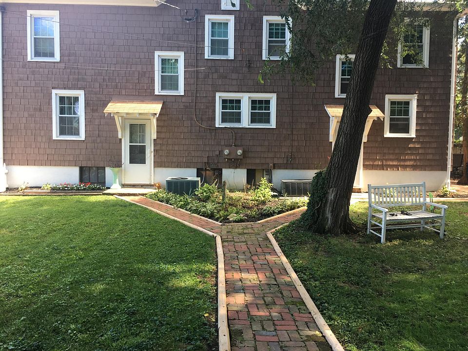 backyard. enclosed by white picket fence.