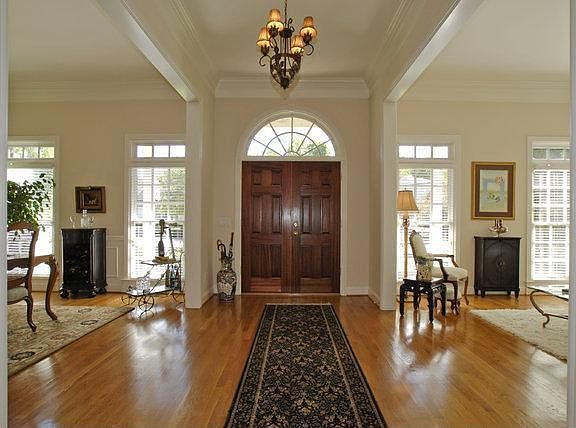 Large entry way with 10 Ft. ceilings. The molding is beautiful!