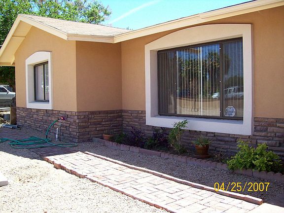 Brand new stucco exterior and landscape.