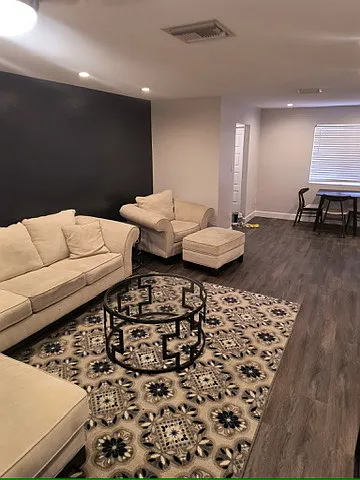Living room looking toward the dining and kitchen. - 4354 N 82nd St #205