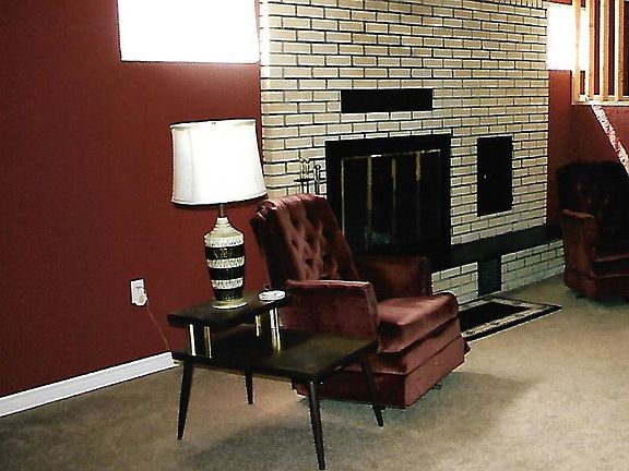 Downstairs family room with fireplace.