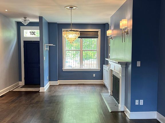 Welcome! Open floor plan for both dining and living rooms, showcasing the brand new hardwood floors throughout