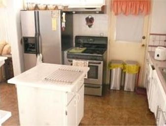 Kitchen has center island