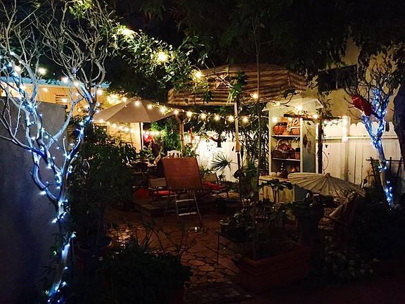 Charming patio garden area at night.