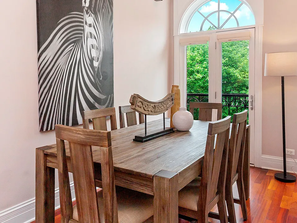 The dining area easily fits a table for 8-10 and opens to the kitchen and living room and is a sun f
