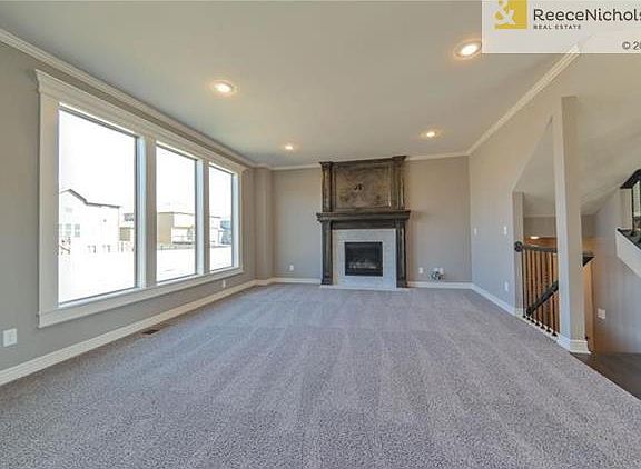 Great Room with oversized gas direct vent sealed until fireplace. Pre-wired for 5-speaker surround sound, security and HDMI under 10'.
