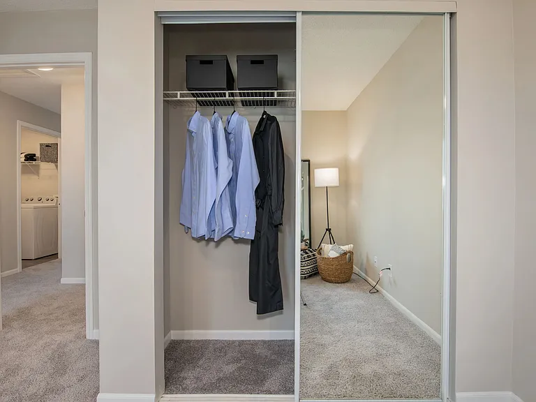Spacious closets with sliding mirror doors for filling the room with brightness.