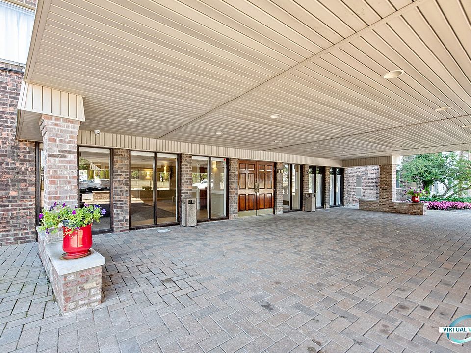Front door with paver circular driveway