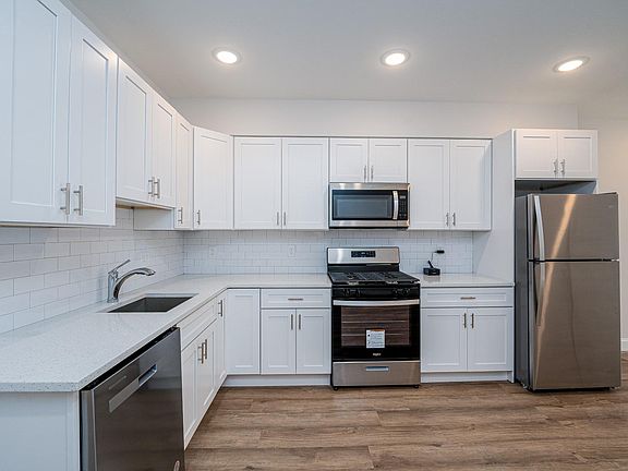 Kitchen w/Quartz Tops, SS appliances, gas cooking, vented microwave too!