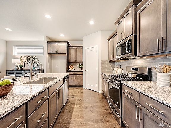 Plan 2101 Elevation A built at another Harbour Homes community.  Details will vary