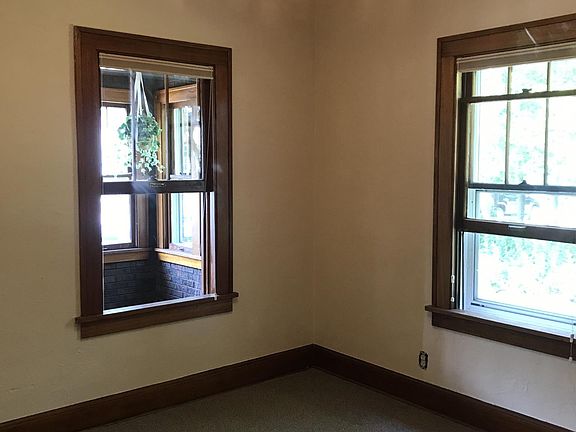 First floor front bedroom with view to enclosed front porch