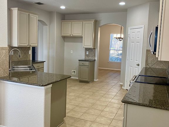 From the dinette looking toward the formal dining room. Tons of counter space and storage. Door to the right is the walk-in pantry