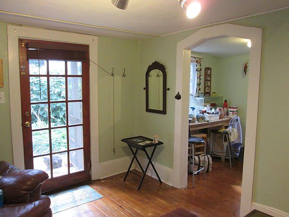 living room, hardwood floors, french door, kitchen entrance