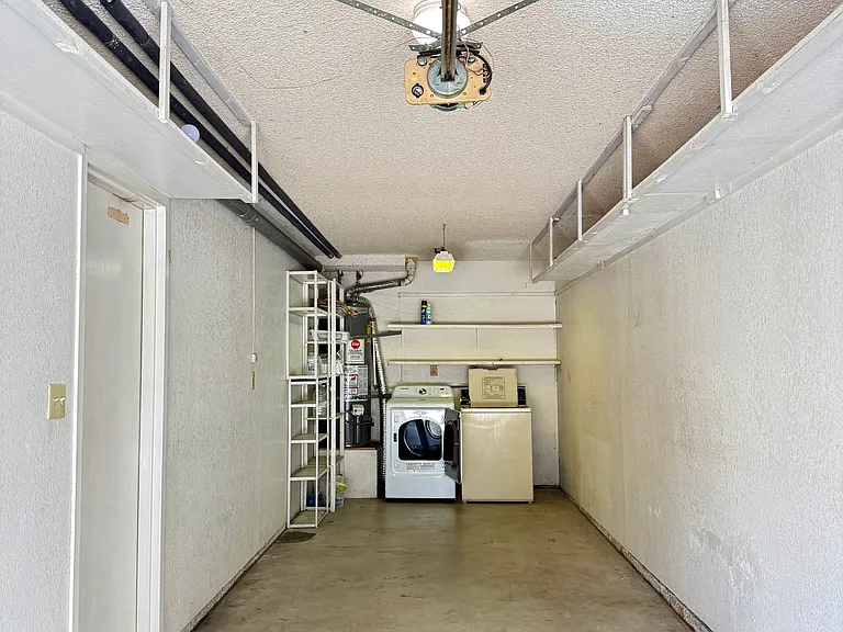 Garage has remote door opener. storage shelves. Enter the house from garage to the left.
