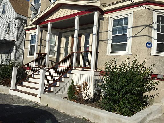 Street-side view of property. On street - Residents Only parking. From this front of building picture you'd never know that across the road from your rear - beach side - living room (and deck) is a spectacular view up full 5 mile length of Revere Beach