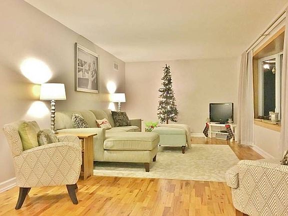 Welcoming you into this home are freshly refinished wood floors that flow throughout the living room. Relax and enjoy your  favorite movie or your new favorite book in this inviting room. 